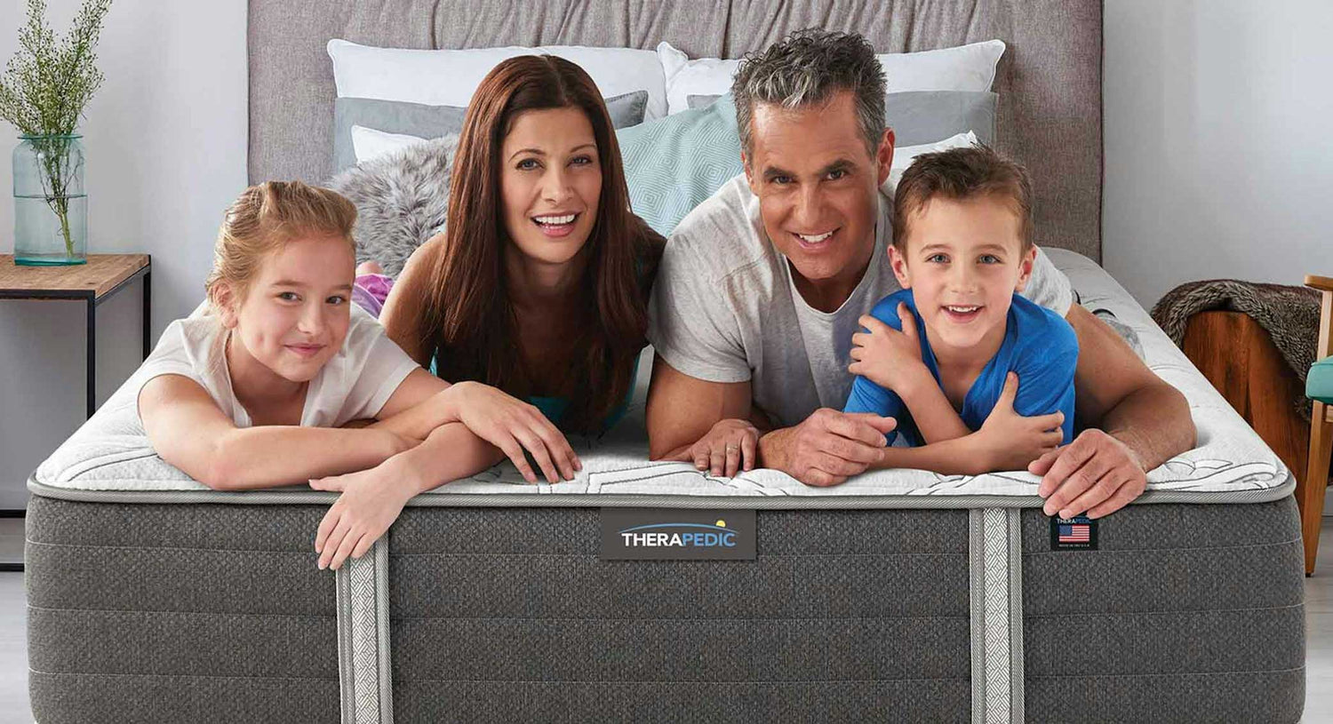 Family laying on the bed