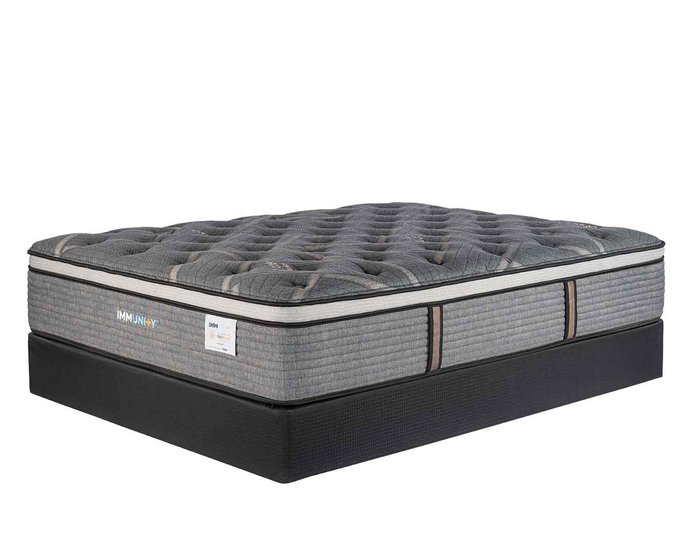 Immunity Auburn copper mattress on agility foundation at an angle with a white background.