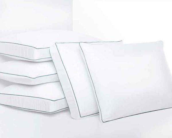 Photo of the memory foam pillows stacked on a bed