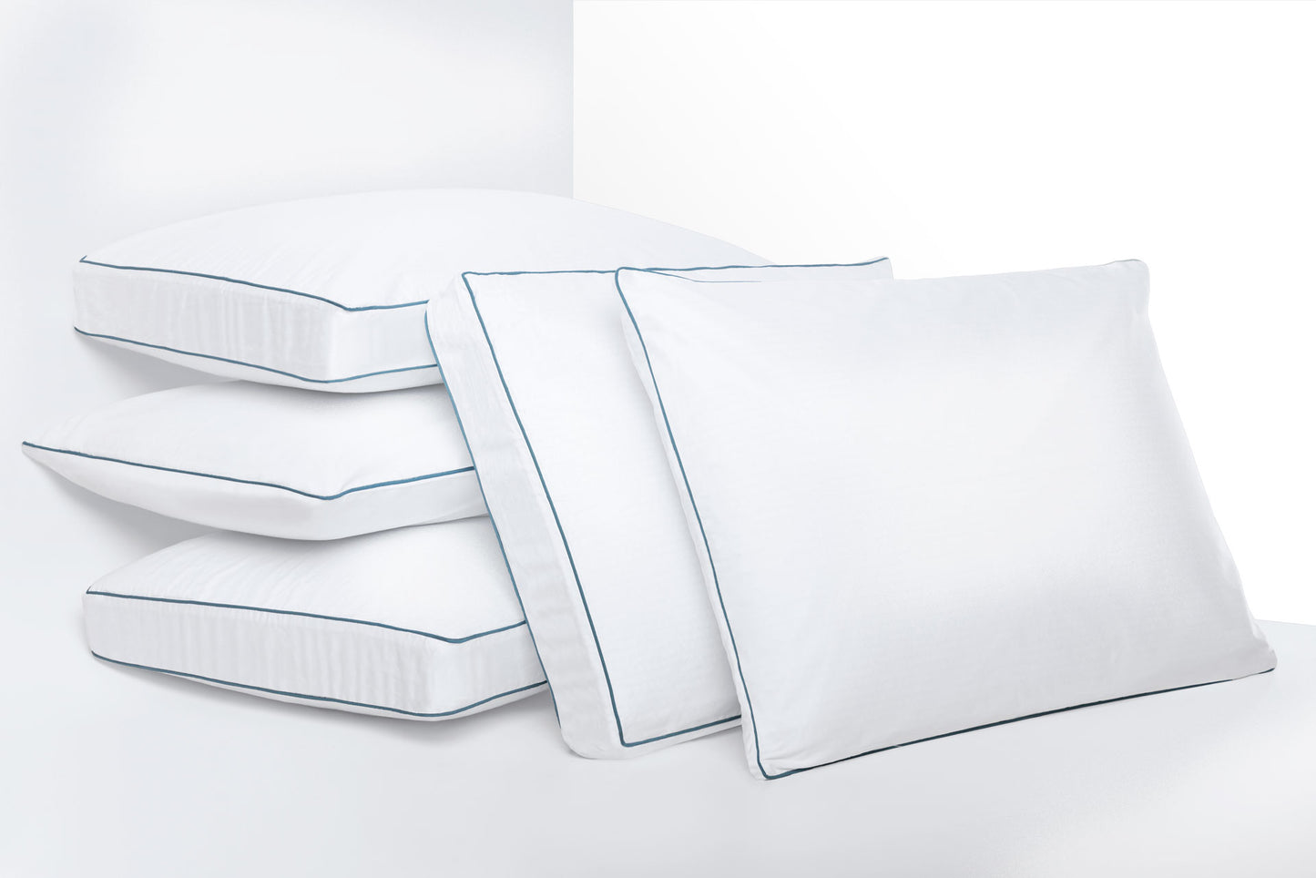 Photo of the 5 agility cool memory foam pillows, 3 stacked on top of each other and two leaning against the stacked pillows