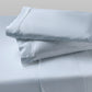 Sheet set with two pillows stacked on top of each other in Zen Blue