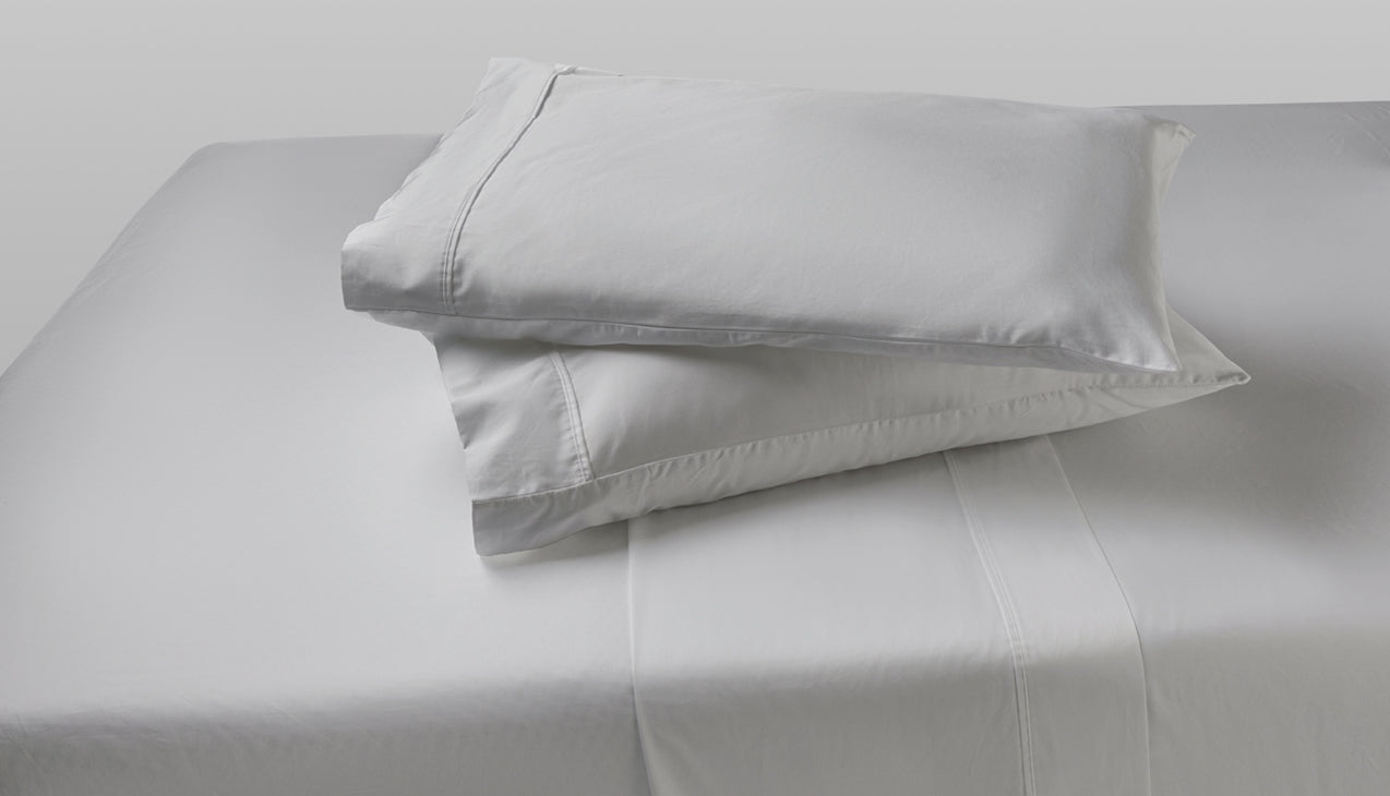 Sheet set with two pillows stacked on top of each other