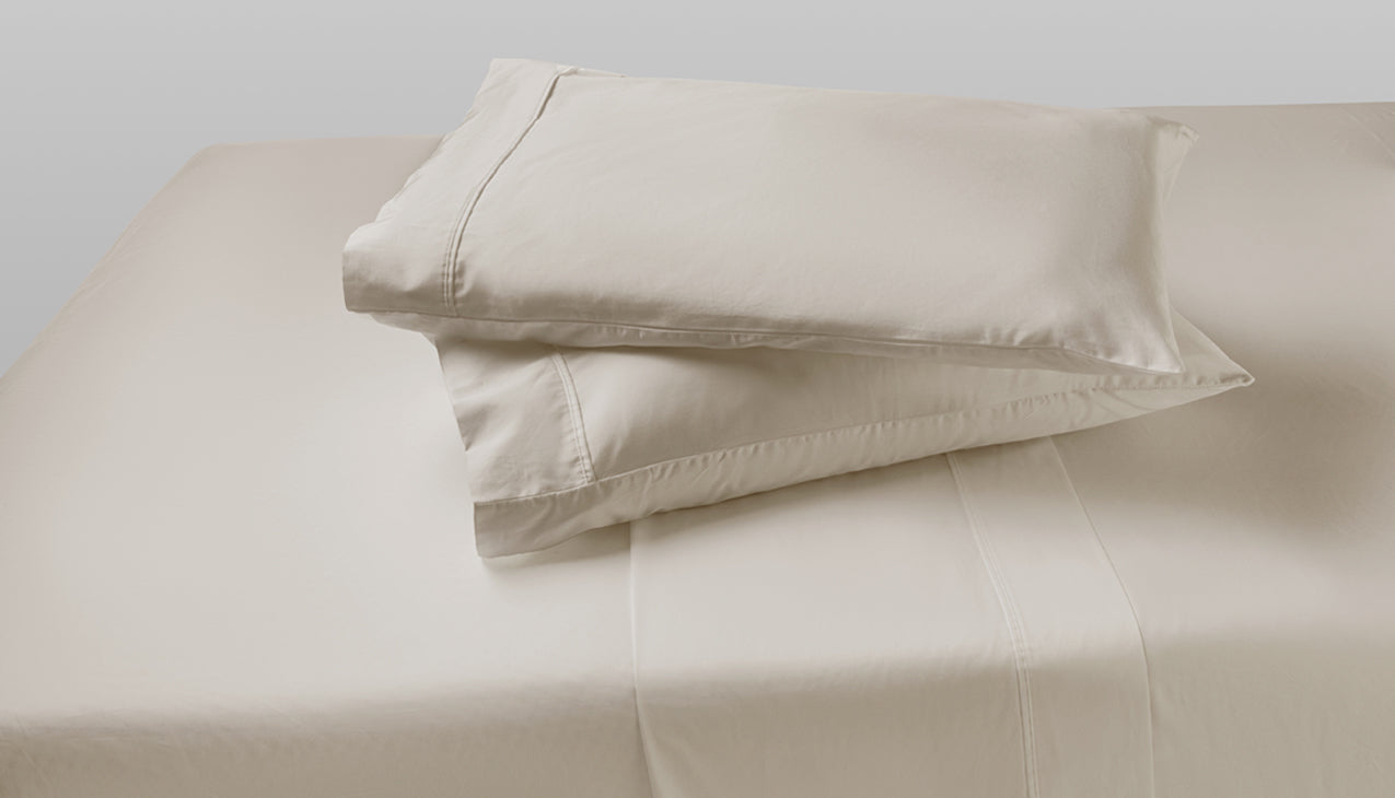 Sheet set with two pillows stacked on top of each other in Moonbeam Linen color