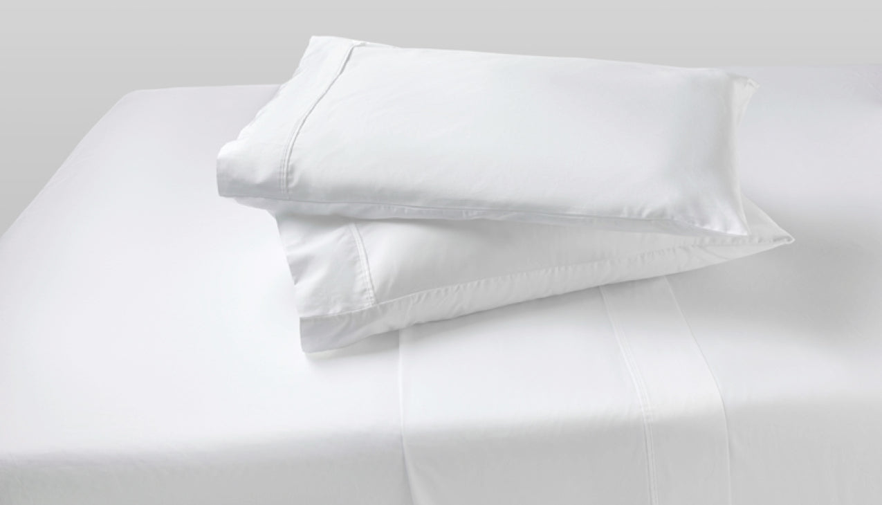 Two agility cool foam pillows stack on top of each other with Bright White pillow sheets